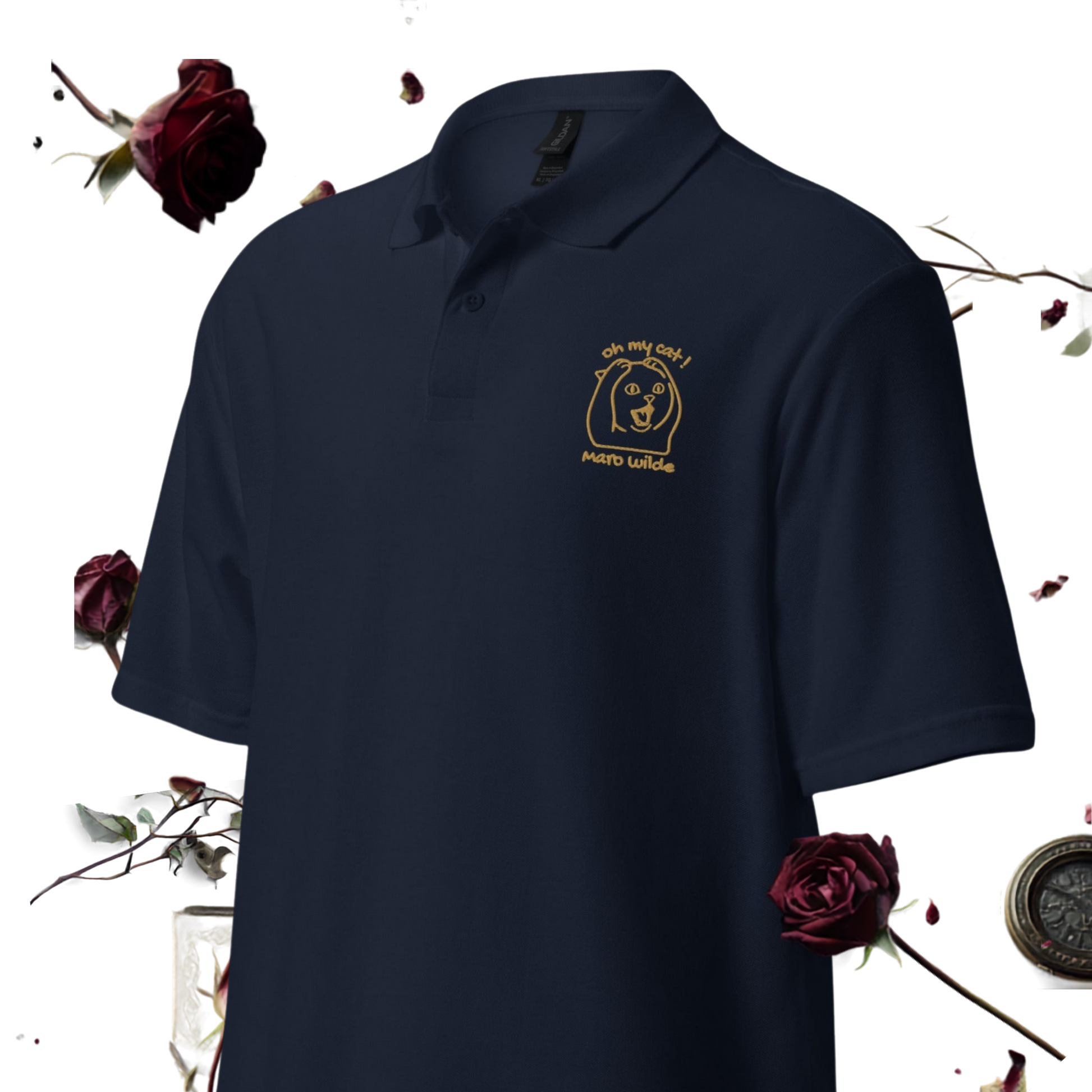 A navy blue polo shirt with a gold embroidered logo on the left chest, displayed against a white background with decorative dark red roses and a compass.