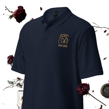 A navy blue polo shirt with a gold embroidered logo on the left chest, displayed against a white background with decorative dark red roses and a compass.